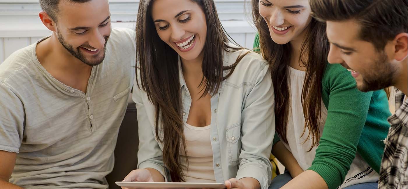 Group of young people looking at tablet.!''